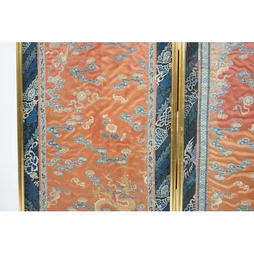 339 - A pair of Chinese coral silk dragon panels, 19th century, worked in polychrome silk and gold threa... 