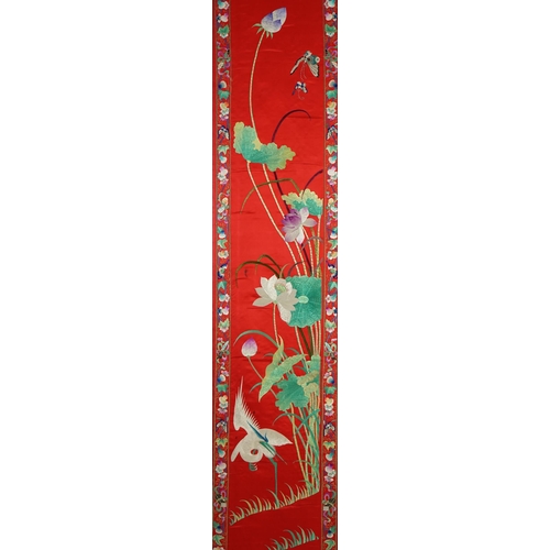 340 - A Chinese embroidered silk wall hanging, early 20th century, decorated with an egret amid lotus, on ... 