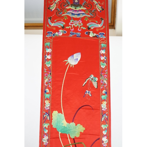 340 - A Chinese embroidered silk wall hanging, early 20th century, decorated with an egret amid lotus, on ... 