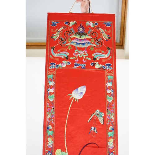 340 - A Chinese embroidered silk wall hanging, early 20th century, decorated with an egret amid lotus, on ... 