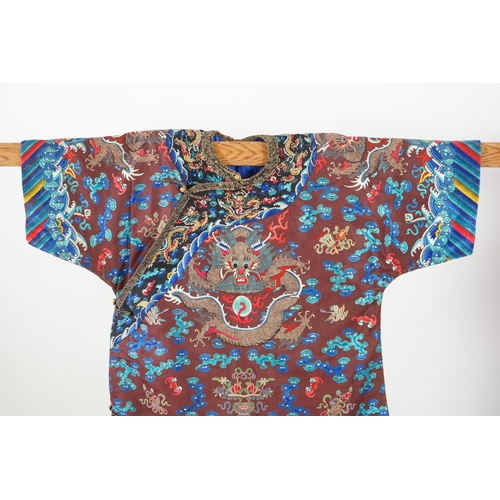 343 - A Chinese brown silk court robe for an Imperial Duke, jifu, late 19th century, embroidered to the br... 