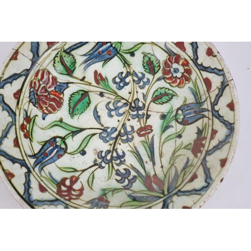 344 - An Iznik pottery dish, Ottoman Turkey, 17th century, 27cm diameter, repaired, with two books on Isla... 