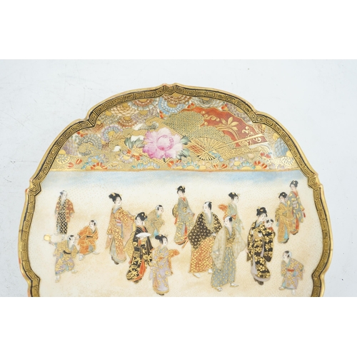 39 - A Japanese Satsuma barbed rim dish, Meiji period, painted to a rectangular reserve with a procession... 