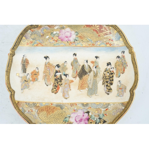 39 - A Japanese Satsuma barbed rim dish, Meiji period, painted to a rectangular reserve with a procession... 