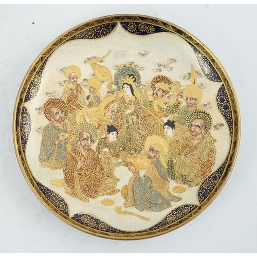 40 - A Japanese Satsuma circular dish, Meiji period, painted with Kwannon, attendants, rakan and a dragon... 