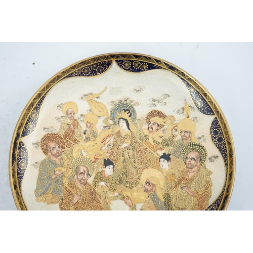 40 - A Japanese Satsuma circular dish, Meiji period, painted with Kwannon, attendants, rakan and a dragon... 