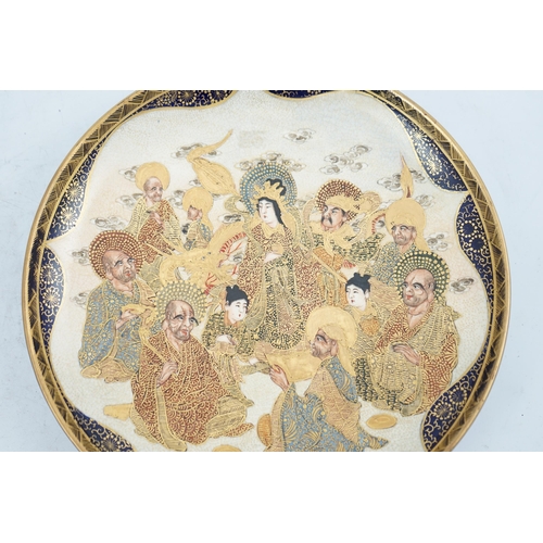 40 - A Japanese Satsuma circular dish, Meiji period, painted with Kwannon, attendants, rakan and a dragon... 