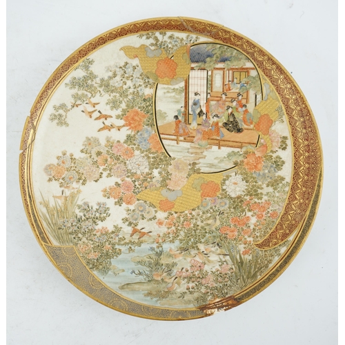 42 - A Japanese Satsuma circular dish, Meiji period, painted with ladies and children in a pavilion withi... 