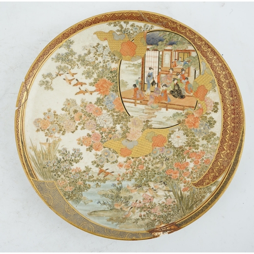 42 - A Japanese Satsuma circular dish, Meiji period, painted with ladies and children in a pavilion withi... 