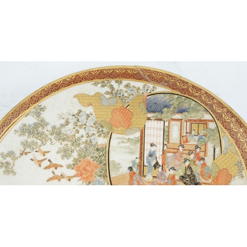 42 - A Japanese Satsuma circular dish, Meiji period, painted with ladies and children in a pavilion withi... 