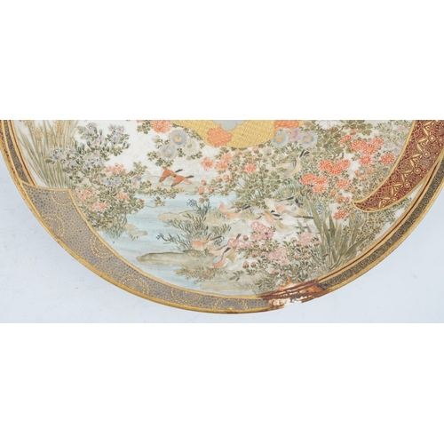 42 - A Japanese Satsuma circular dish, Meiji period, painted with ladies and children in a pavilion withi... 