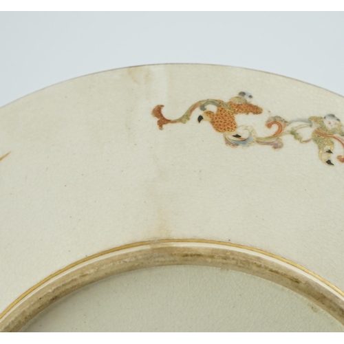 42 - A Japanese Satsuma circular dish, Meiji period, painted with ladies and children in a pavilion withi... 