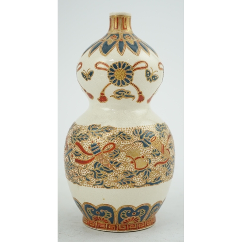 43 - A Japanese Satsuma double gourd-shaped vase, 19th century, the upper section painted with ribbon tie... 