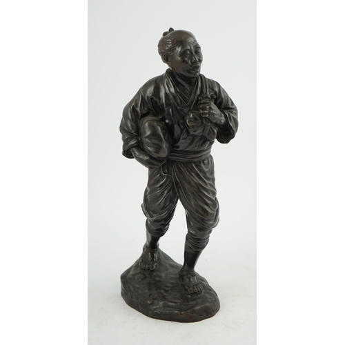 55 - A Japanese bronze figure of a man, 19th century, carrying fabric wrapped packages suspended from str... 