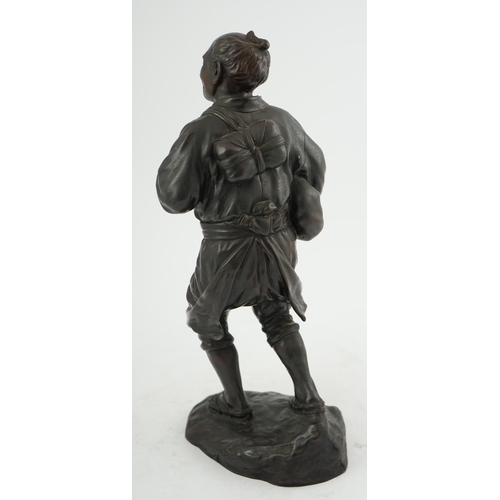 55 - A Japanese bronze figure of a man, 19th century, carrying fabric wrapped packages suspended from str... 