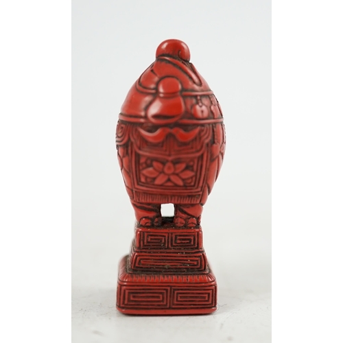 62 - A small Japanese tsuishu (carved red lacquer) seal netsuke, 19th century, modelled as a stylised ele... 