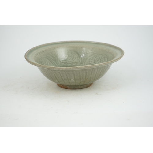 66 - A large Thai celadon glazed bowl, Sawankhalok kilns, 14th / 15th century, heavily-potted with flared... 