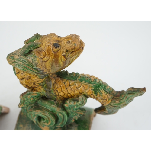 74 - Two Chinese sancai dragon-fish ridge tiles, Ming dynasty, each figure leaping above waves, largest... 