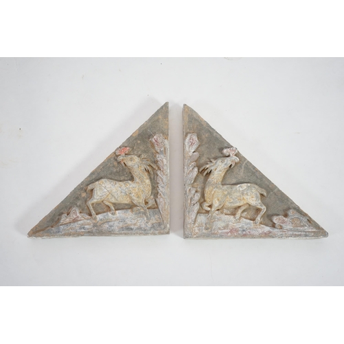 78 - A fine pair of large Chinese painted pottery triangular tiles, Ming Dynasty (1368-1644), made from g... 