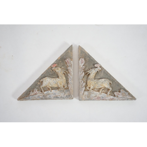 78 - A fine pair of large Chinese painted pottery triangular tiles, Ming Dynasty (1368-1644), made from g... 