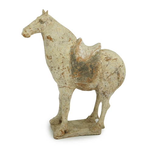 79 - A Chinese painted pottery saddled horse, Tang Dynasty (AD 618-906), in red pottery that has been &qu... 