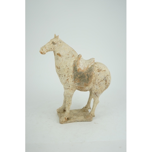 79 - A Chinese painted pottery saddled horse, Tang Dynasty (AD 618-906), in red pottery that has been &qu... 