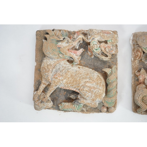 82 - A fine pair of large Chinese painted pottery Qilin, Sun and Moon tiles, Ming Dynasty (1368-1644) e... 