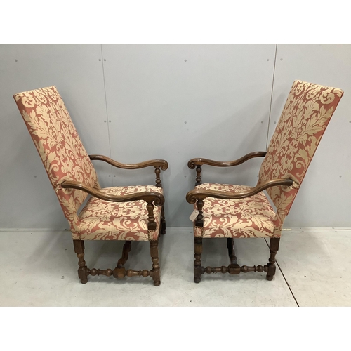 1016 - A pair of Louis XIV style walnut open armchairs, width 66cm, height 121cm. Condition - light rubbing... 