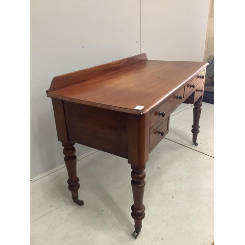 1035 - A Victorian mahogany four drawer side table, width 121cm, height 82cm. Condition - fair