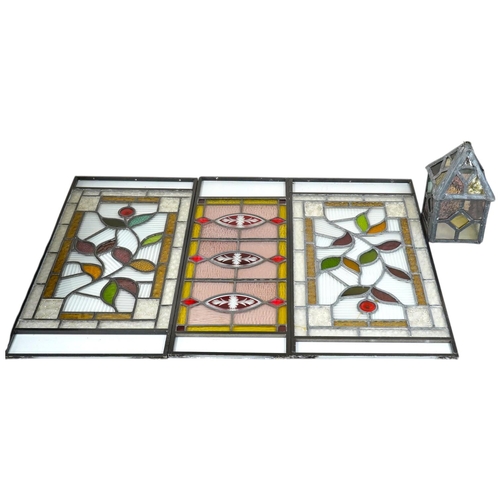 1408 - Three stained glass panels in metal frames and a stained glass lantern, longest 55.5cm. Condition - ... 