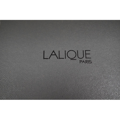 1414 - A Lalique Singapore pattern frosted glass scent bottle and stopper in associated Lalique box, bott... 