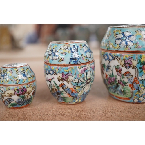 1417 - A Chinese porcelain nest of five enamelled porcelain barrel shaped boxes, c.1900, largest 12cm high.... 