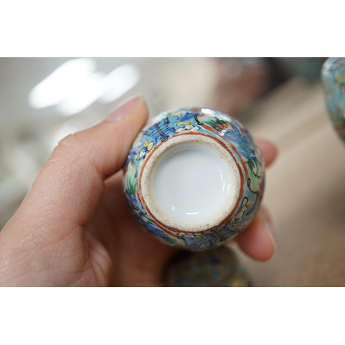 1417 - A Chinese porcelain nest of five enamelled porcelain barrel shaped boxes, c.1900, largest 12cm high.... 