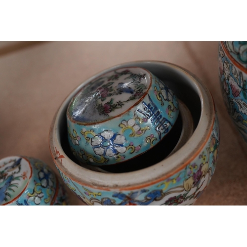 1417 - A Chinese porcelain nest of five enamelled porcelain barrel shaped boxes, c.1900, largest 12cm high.... 