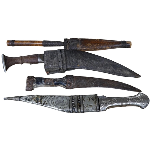 1426 - Three daggers, two with sheaths and a kukri knife, largest 33cm in length. Condition - poor
