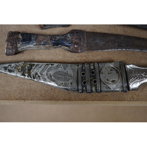 1426 - Three daggers, two with sheaths and a kukri knife, largest 33cm in length. Condition - poor