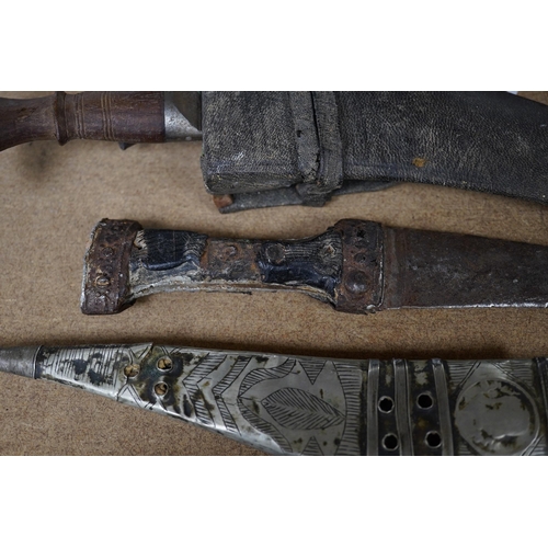 1426 - Three daggers, two with sheaths and a kukri knife, largest 33cm in length. Condition - poor