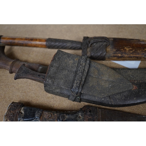 1426 - Three daggers, two with sheaths and a kukri knife, largest 33cm in length. Condition - poor