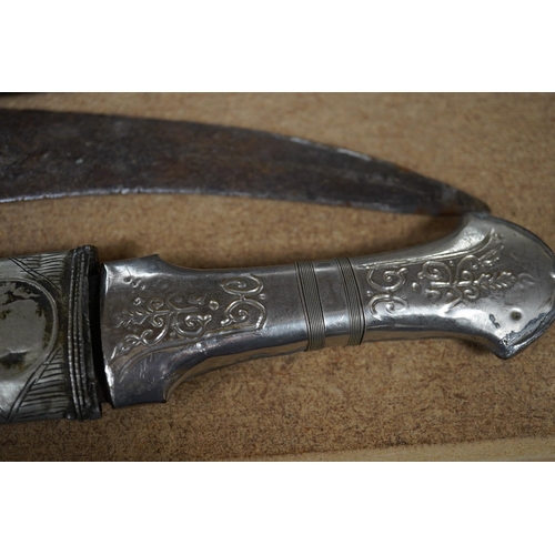 1426 - Three daggers, two with sheaths and a kukri knife, largest 33cm in length. Condition - poor