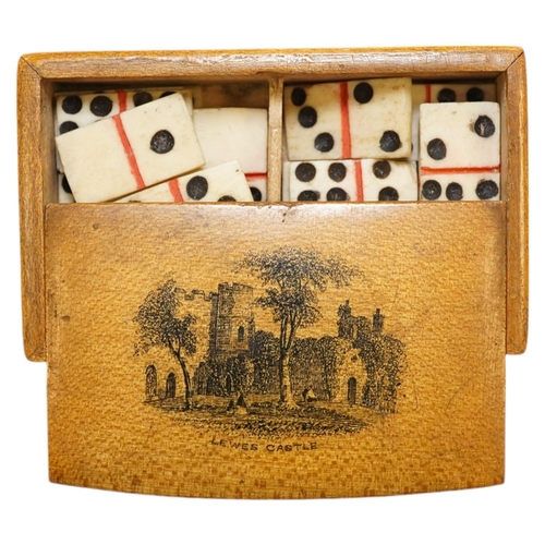 1436 - A Mauchline ware Lewes Castle box containing a full set of bone dominoes, 5cm. Condition - fair to... 