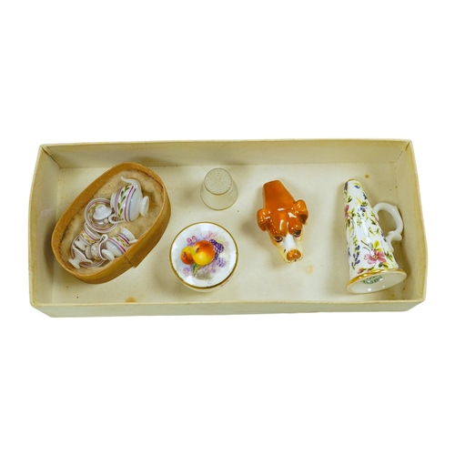 1440 - A mixed collection of miniature items including a hound whistle, a candle snuffer and a glass tea se... 