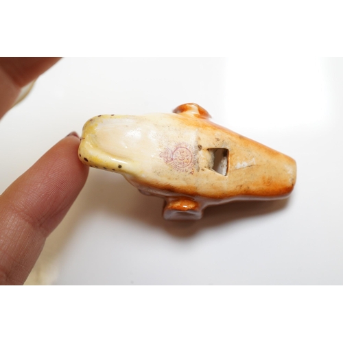 1440 - A mixed collection of miniature items including a hound whistle, a candle snuffer and a glass tea se... 