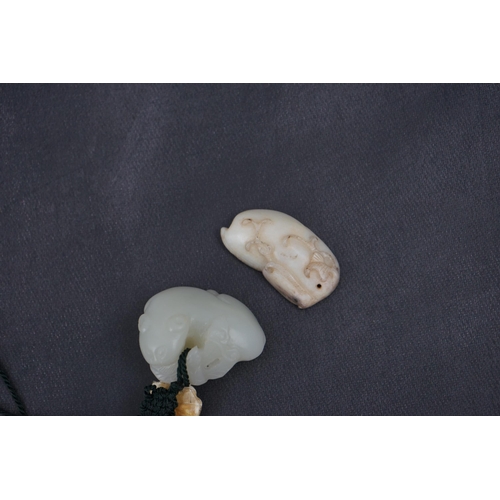 1441 - Two Chinese jade carvings, 18th/19th century including a pale jade example in the form of an animal ... 