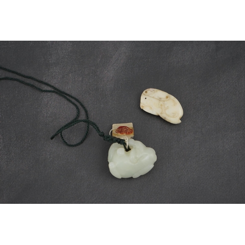 1441 - Two Chinese jade carvings, 18th/19th century including a pale jade example in the form of an animal ... 