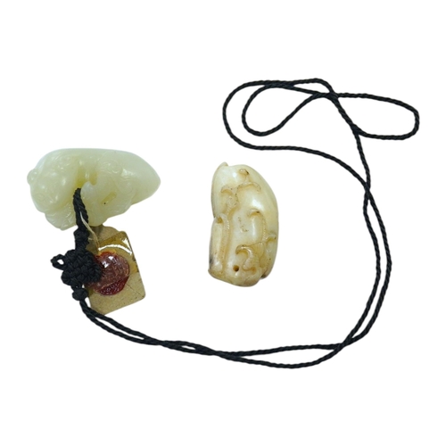 1441 - Two Chinese jade carvings, 18th/19th century including a pale jade example in the form of an animal ... 
