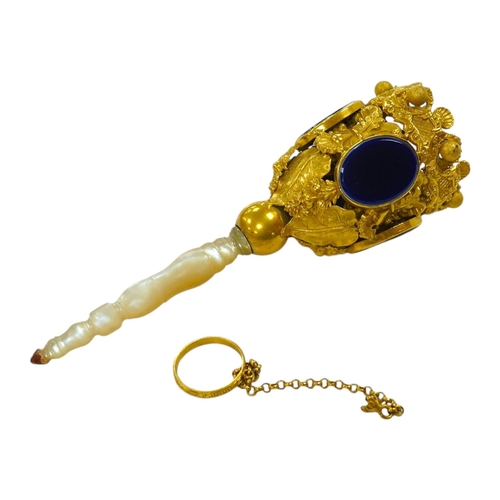 1442 - A 19th century Pinchbeck posy holder with mother of pearl handle and inset blue glass panels. Condit... 