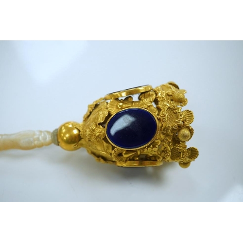 1442 - A 19th century Pinchbeck posy holder with mother of pearl handle and inset blue glass panels. Condit... 