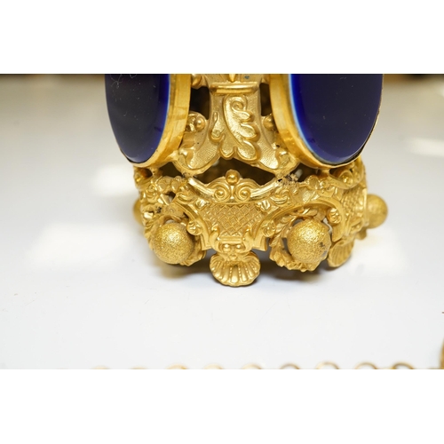 1442 - A 19th century Pinchbeck posy holder with mother of pearl handle and inset blue glass panels. Condit... 