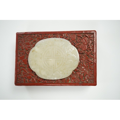 1449 - A Chinese carved jade mounted cinnabar lacquer box, 19th / 20th century, 14cm wide. Condition - fair... 