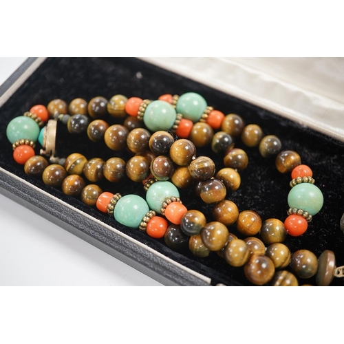 1450 - A Chinese silver and enamel amulet tiger's eye, coral and turquoise bead necklace, housed in a liber... 
